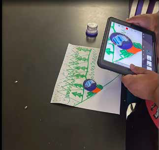 A tablet capturing colorful paper characters for animation